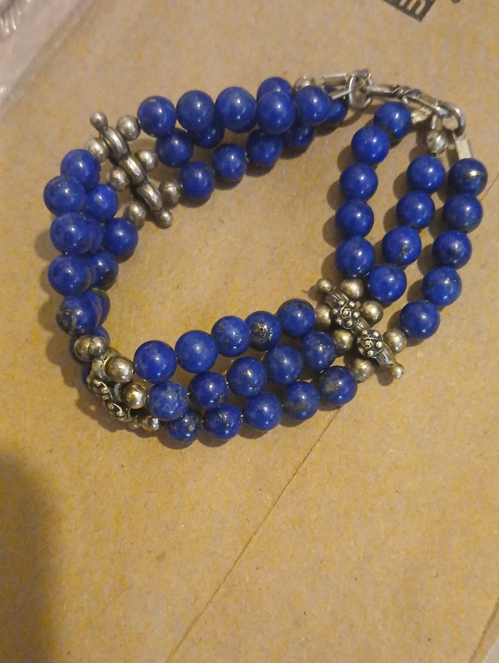 triple-strand bracelet made with blue lapis lazuli